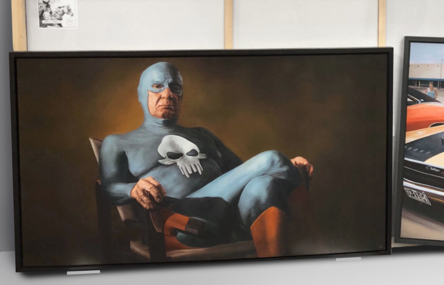 ”Sitting” Aluminium plate with black frame.